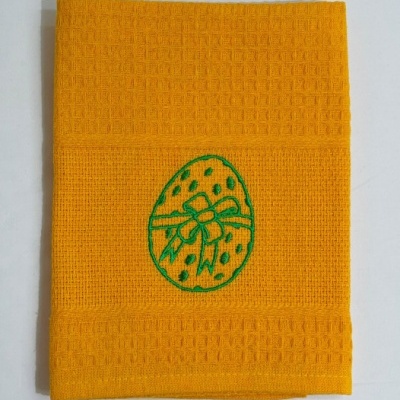 Toalha de cozinha amarela com bordado verde de ovo de Páscoa
