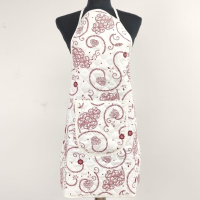 Avental branco com padrão vermelho num manequim preto
