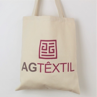 Saco de pano bege com logotipo vermelho e castanho AG TÊXTIL