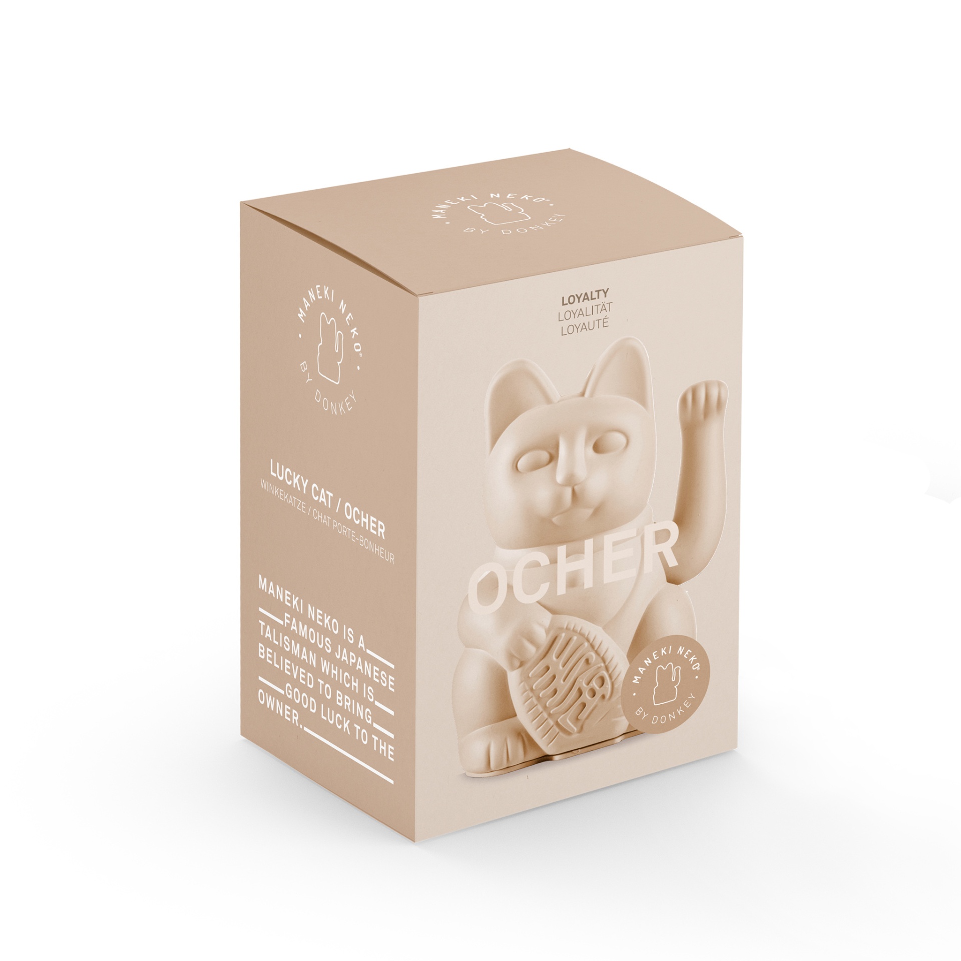GATO DA SORTE OCRE DONKEY Caixa de embalagem bege com gato da sorte ocre em relevo e texto explicativo em inglês