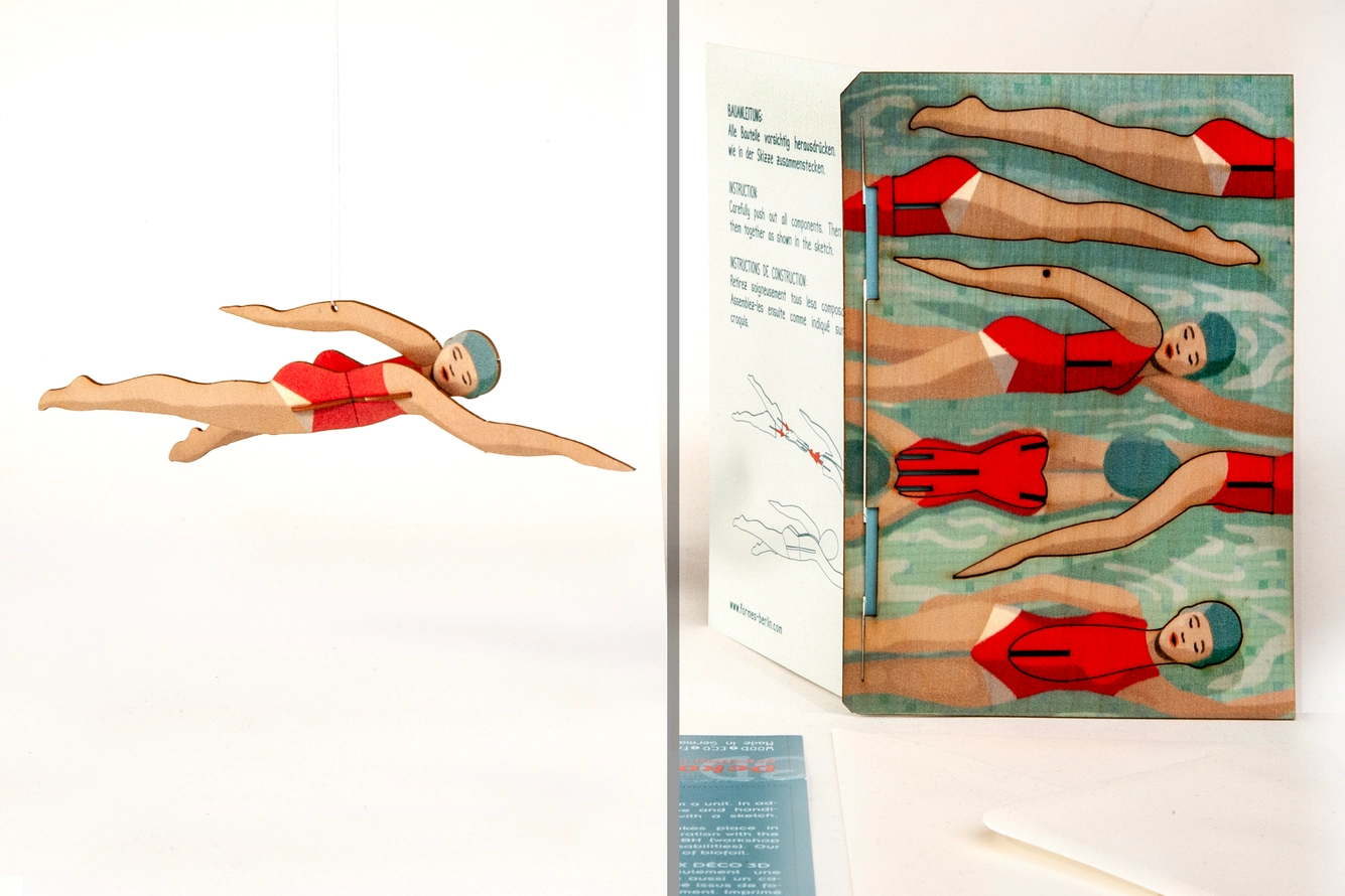 SWIMMER - 3D DECO GREETING CARD FORMES BERLIN Figura de nadadora em maiô vermelho em várias posições e embalagem com texto em inglês