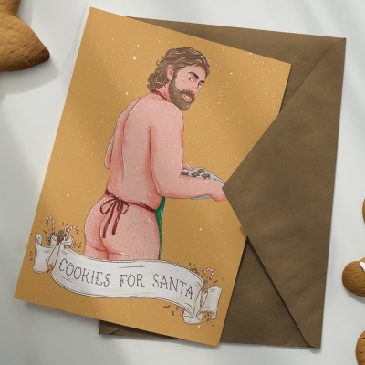 Cartão ilustrado com homem de costas segurando bolachas, texto 'COOKIES FOR SANTA' e envelope castanho