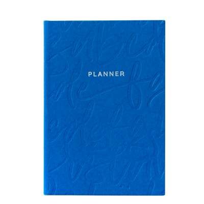 Planner azul com textura em relevo e texto PLANNER