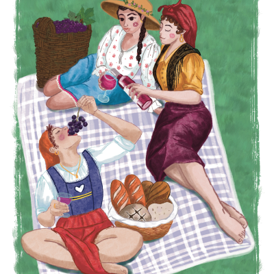 Três mulheres com roupas tradicionais a fazer um piquenique em campo verde sobre manta xadrez, com pão e uvas.