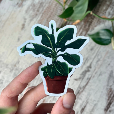 Adesivo de planta em vaso vermelho com folhas verdes