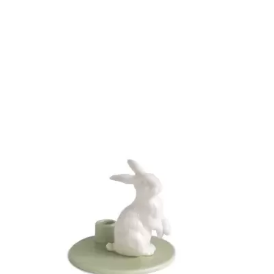 Suporte para vela com coelho branco em cerâmica sobre base verde clara