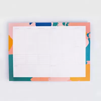 Bloco de papel semanal com padrão colorido e espaços para anotações