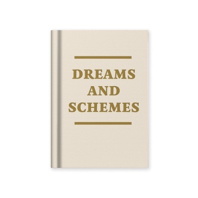 Livro capa dura bege claro com texto dourado DREAMS AND SCHEMES