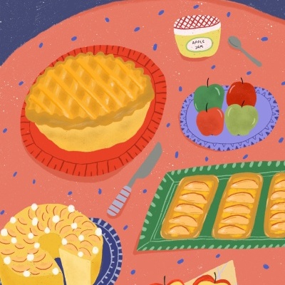 Mesa com bolo, tarte, pastelaria, maçãs e frasco de congelação