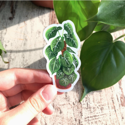 Etiqueta adesiva decorativa de planta com folhas verdes e vaso castanho