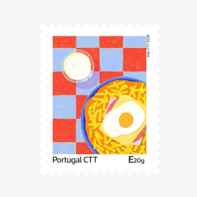 Selo postal com ilustração de prato de comida sobre mesa quadriculada