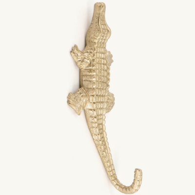 Figura decorativa em forma de crocodilo dourado texturizado