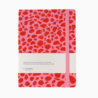 Caderno rosa com manchas vermelhas e texto dourado MY JOURNAL 2026/2027