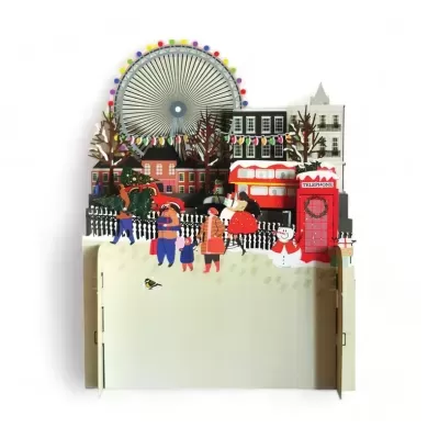 Cartão 3D de cena invernal urbana com crianças, roda gigante, autocarro de dois andares e cabine telefónica vermelha