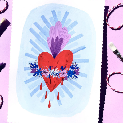 Ilustração de coração vermelho com flores e gotas vermelhas sobre fundo azul claro em papel branco com bordas onduladas, pincel e pulseiras ao redor em superfície rosa.