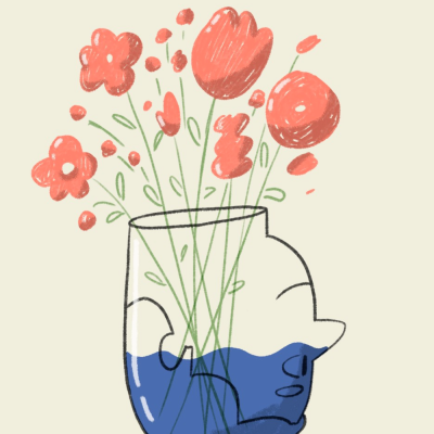 Vaso transparente com água azul e flores vermelhas desenhadas