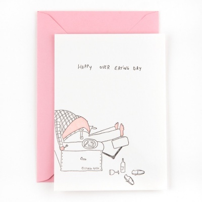 Cartão branco com ilustração e texto 'HAPPY OVER EATING DAY' e envelope rosa
