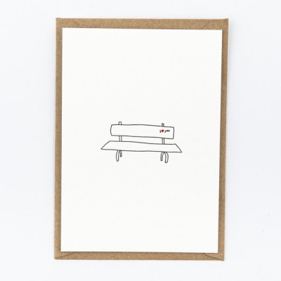 Cartão branco com ilustração minimalista de banco de jardim e texto 'I ♥ you'