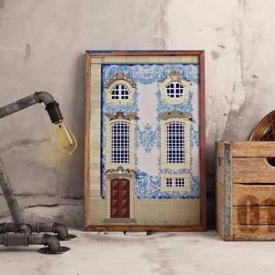 Quadro com imagem de fachada de edifício em azulejos azuis e brancos, com candeeiro industrial e caixa de madeira ao lado