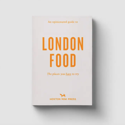 Livro branco com texto laranja 'LONDON FOOD'