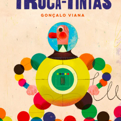 Capa do livro TROCA-TINTAS com boneco robótico colorido em bolas e formas geométricas.