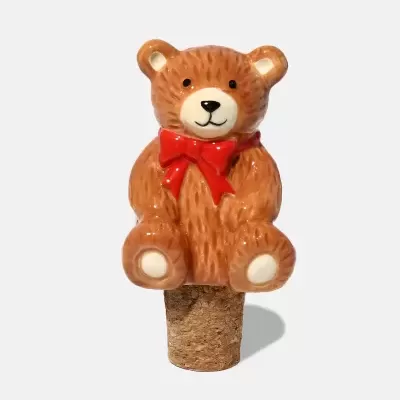 Tampa de garrafa em cortiça com figura de urso castanho de cerâmica com laço vermelho