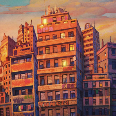 Vários edifícios urbanos com fachadas em tons quentes ao pôr-do-sol