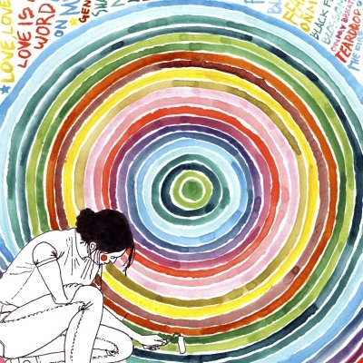 Pessoa a pintar círculos coloridos com texto colorido em volta.