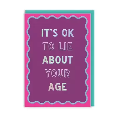 Cartão roxo com moldura rosa e texto ITS OK TO LIE ABOUT YOUR AGE