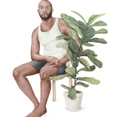 Homem sentado numa cadeira e planta verde num vaso branco