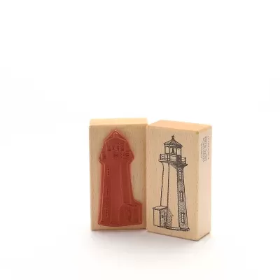 Dois carimbos em madeira com imagem de farol, um com borracha vermelha em relevo e outro com desenho preto.