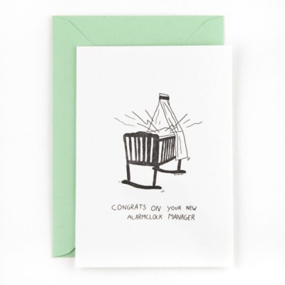 Cartão com ilustração de berço e despertador, mensagem de felicitações