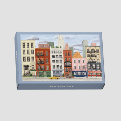 Caixa decorativa azul com ilustração de cidade New York e texto NEW YORK CITY