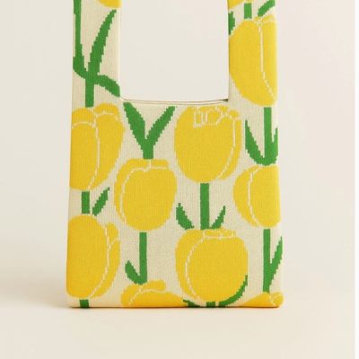 Mala de tecido com estampado de tulipas amarelas e folhas verdes