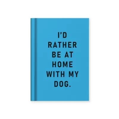 Caderno azul com texto preto 'I'D RATHER BE AT HOME WITH MY DOG.'