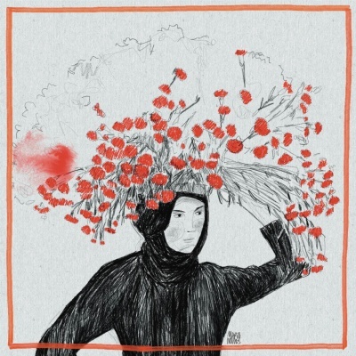 Pessoa com roupa preta e capuz segurando ramo com flores vermelhas em fundo cinza.