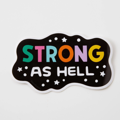 Autocolante preto com texto colorido 'STRONG AS HELL' e estrelas brancas