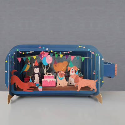 Diorama festa de aniversário com cães e papagaio em caixa azul