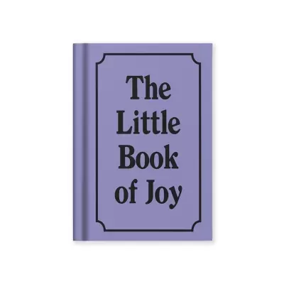 Livro de capa dura lilás com texto preto The Little Book of Joy