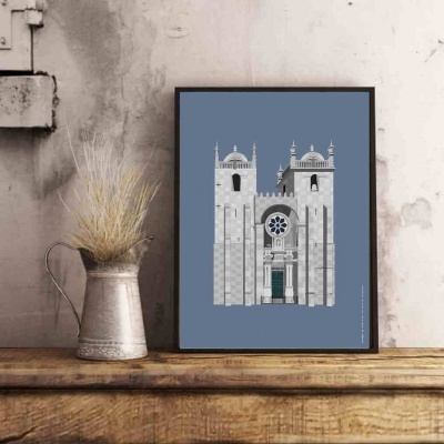Ilustração minimalista de catedral em moldura preta sobre móvel de madeira com jarro metálico e plantas secas