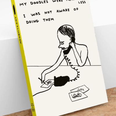 Livro com capa branca, lombada amarela, desenho a preto e texto em inglês