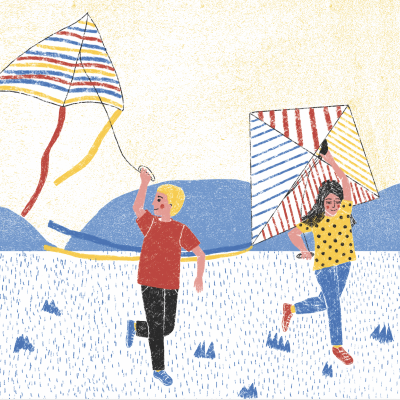 Crianças a brincar com papagaios coloridos nas riscas ao ar livre