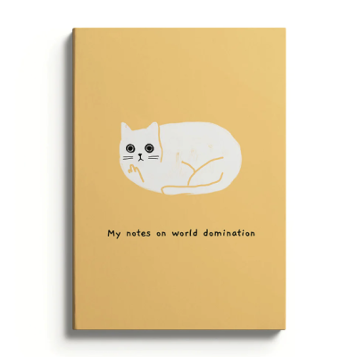 Caderno amarelo com desenho de gato branco e texto em inglês.
