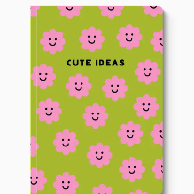 Caderno verde com flores rosa sorridentes e texto CUTE IDEAS