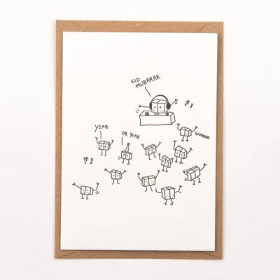 Cartão branco com desenho de robôs e texto Eid Mubarak sobre envelope castanho.