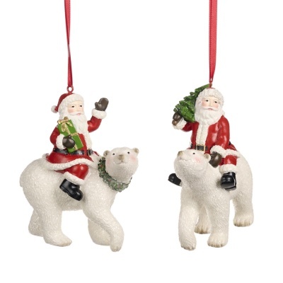 Enfeites de Natal com Pai Natal montado num urso polar branco.