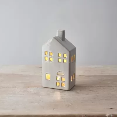 Miniatura de casa branca em cerâmica com luz interior
