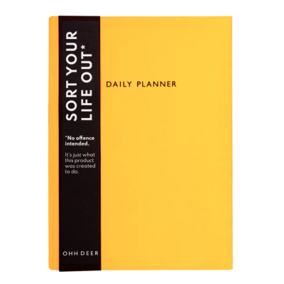 Planner diário amarelo com faixa preta lateral e texto