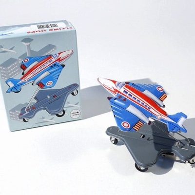 Brinquedo de avião de metal colorido com caixa original