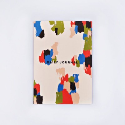 Caderno com capa colorida e texto Daily Journal